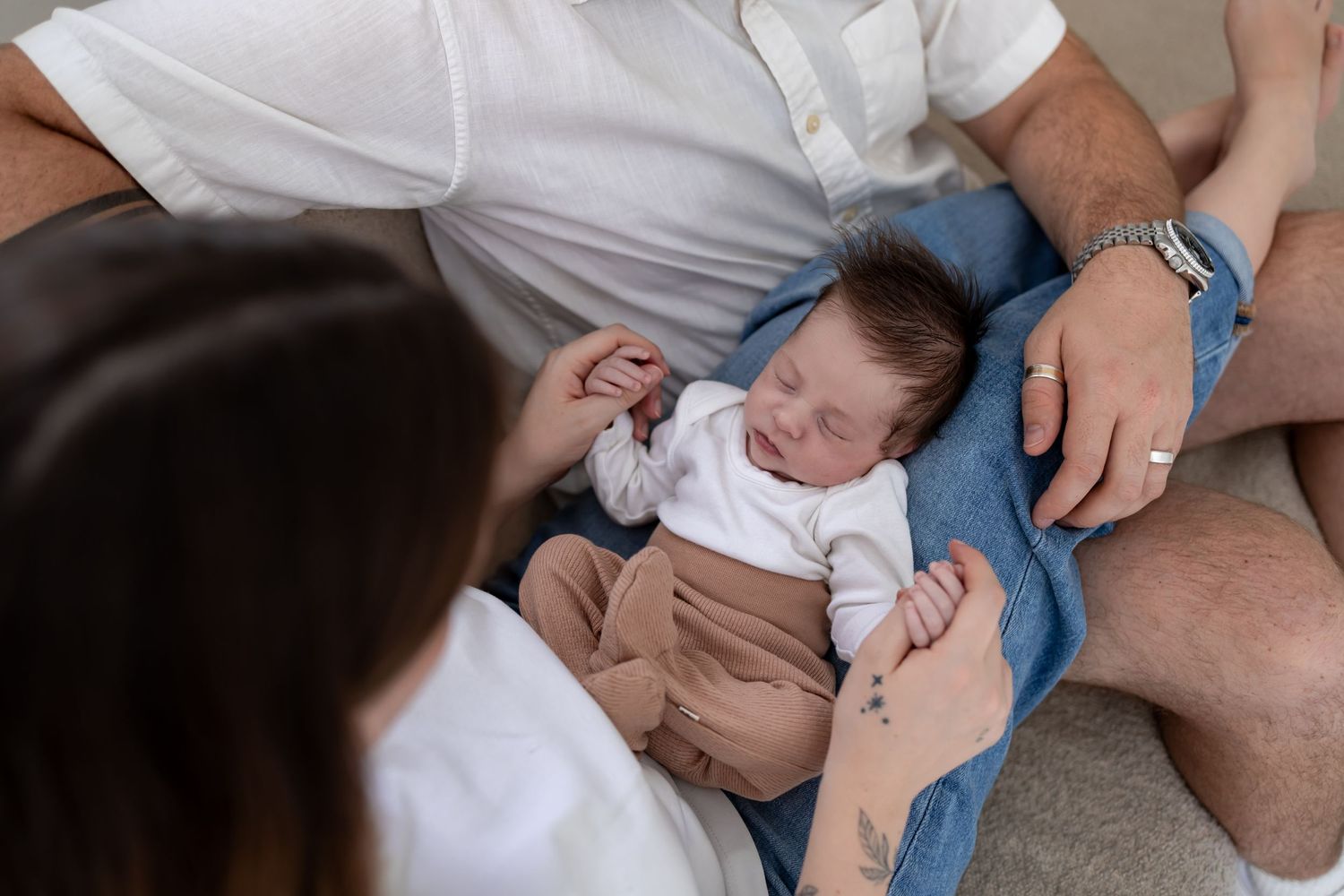 Newborn baby lying on parents during a natural lifestyle session in Centurion Gauteng