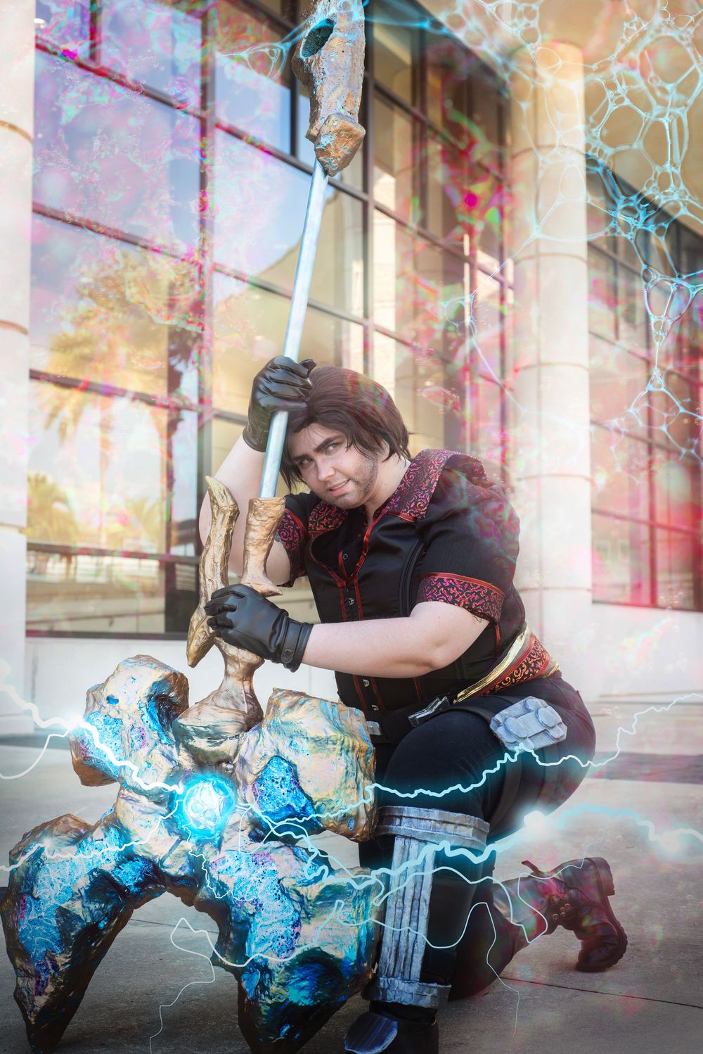 Cosplay session at Megacon portrait of Jayce from Arcane interacting with camera with large hammer prop