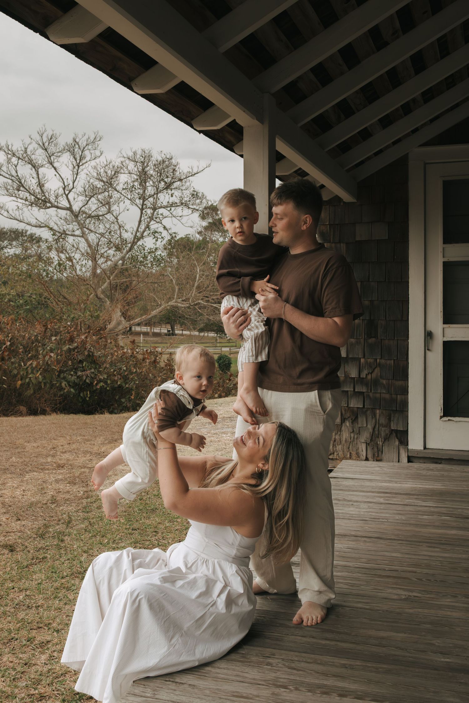 Cute family on the porch laughing in Jupiter Florida