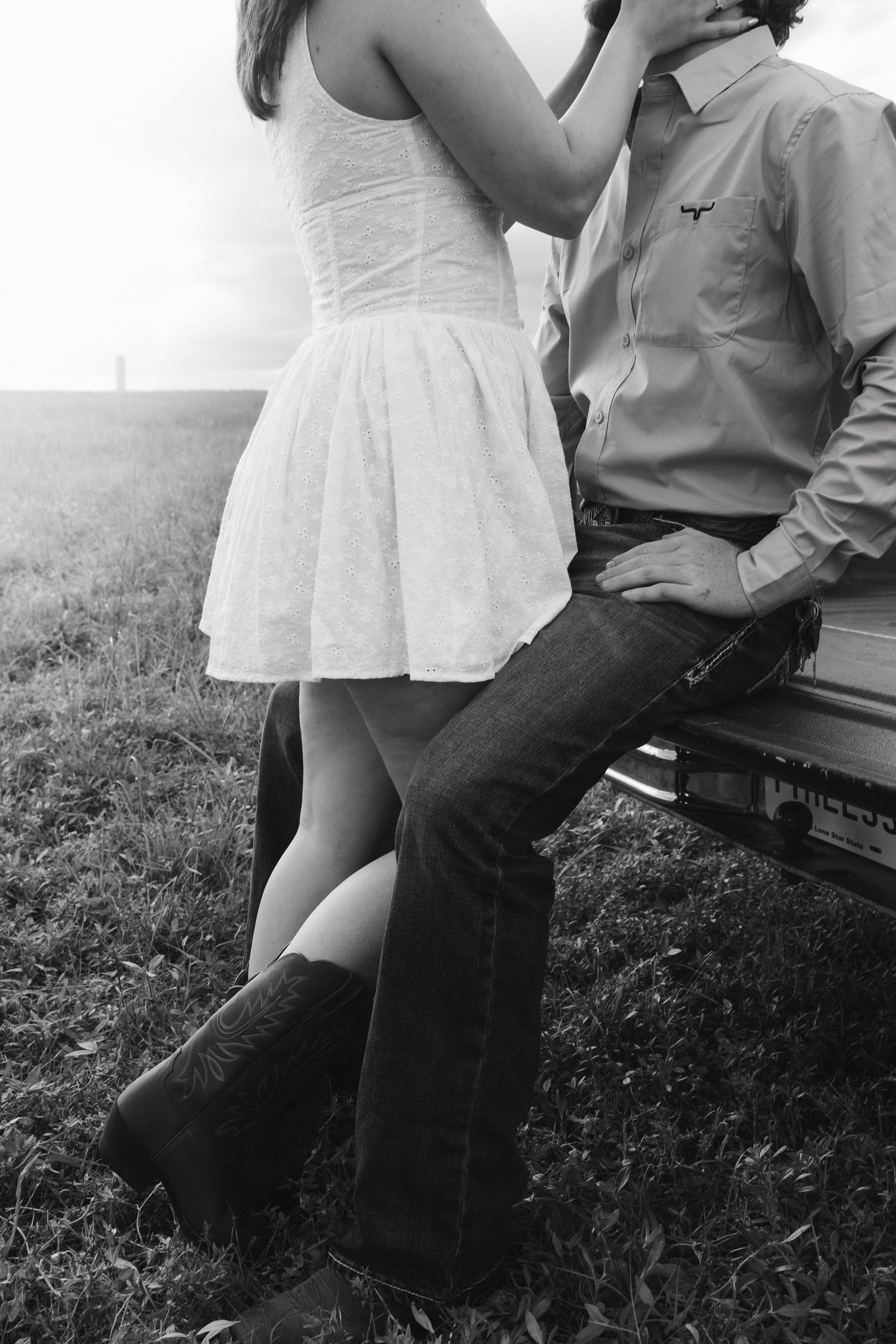 Couple getting cozy in back of vintage truck photoshoot