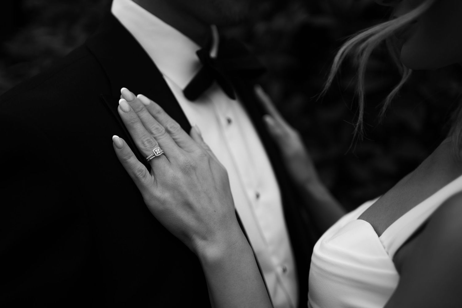 Close-up detail of wedding rings held in the bride’s hand at a London wedding ceremony.