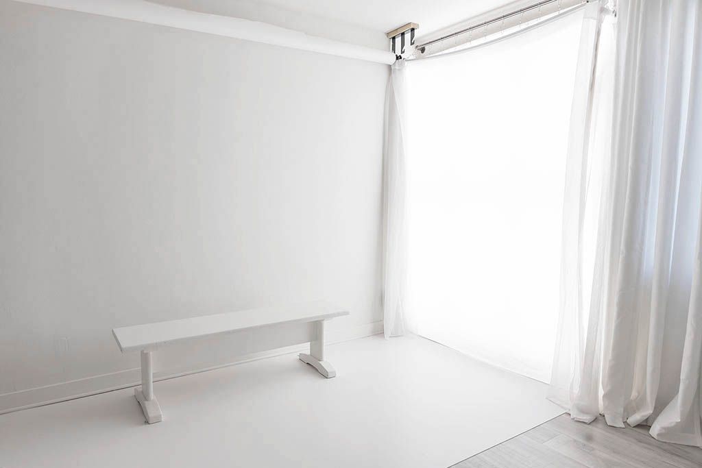 Bright timeless white photography studio in Menifee California; minimalist baby photographer.