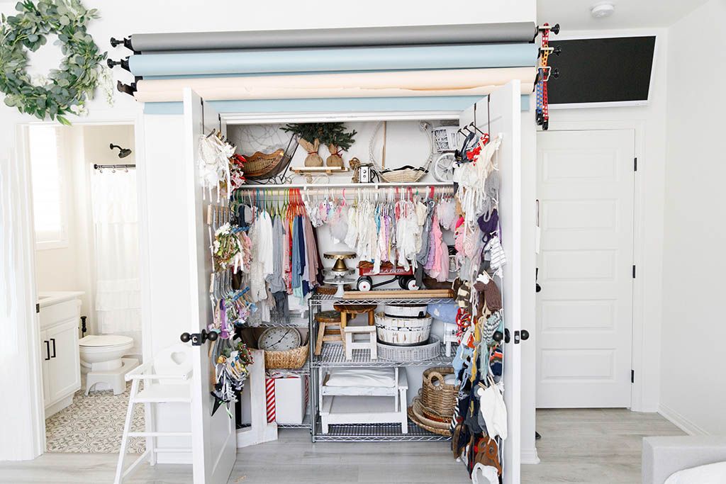 Organized newborn & baby photography studio closet in Menifee, California.