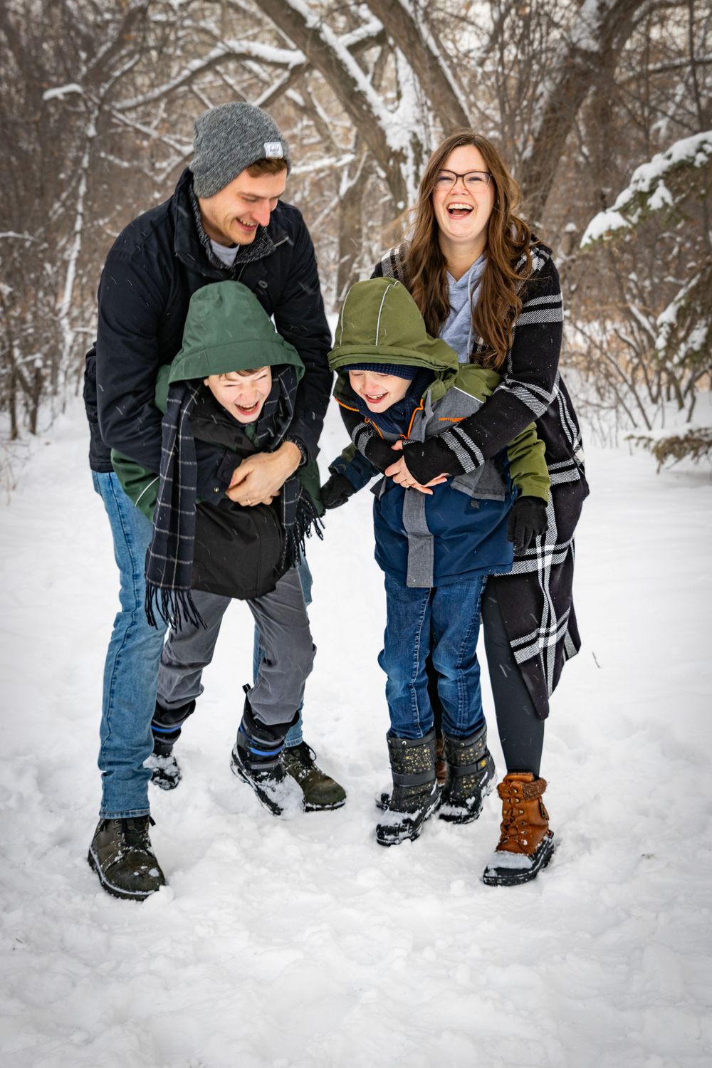 a family in a field in winter.
