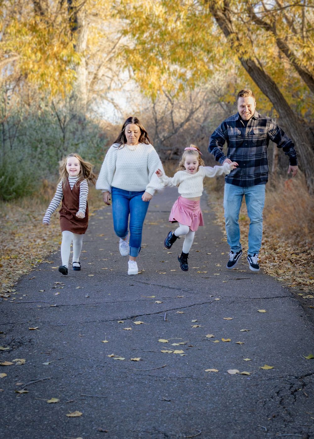 a family playing together on an autumn day.
