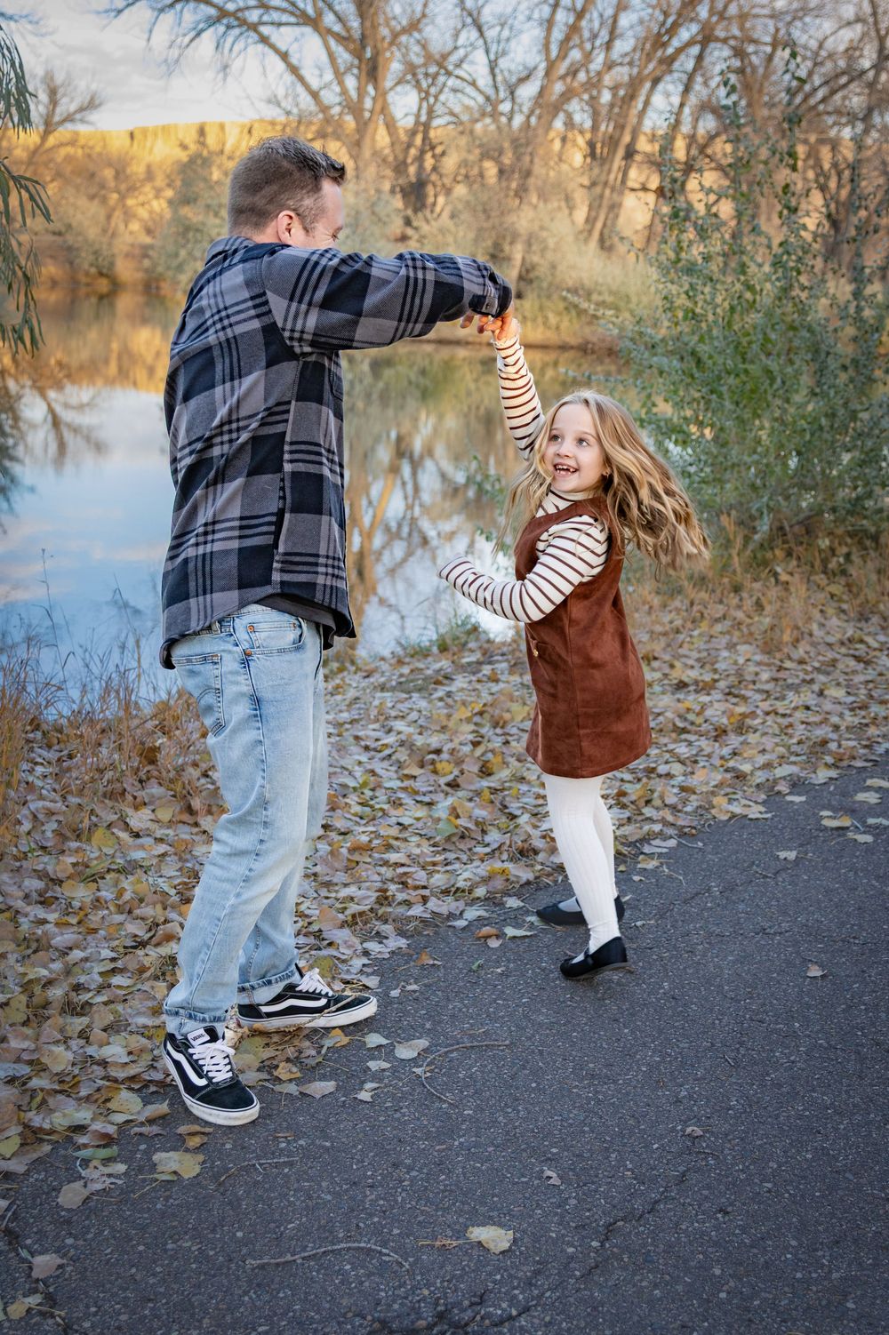 a family playing together on an autumn day.