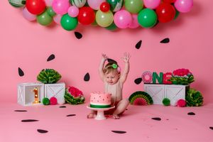 watermelon theme cake smash, pink background with watermelon decorations and balloon garland