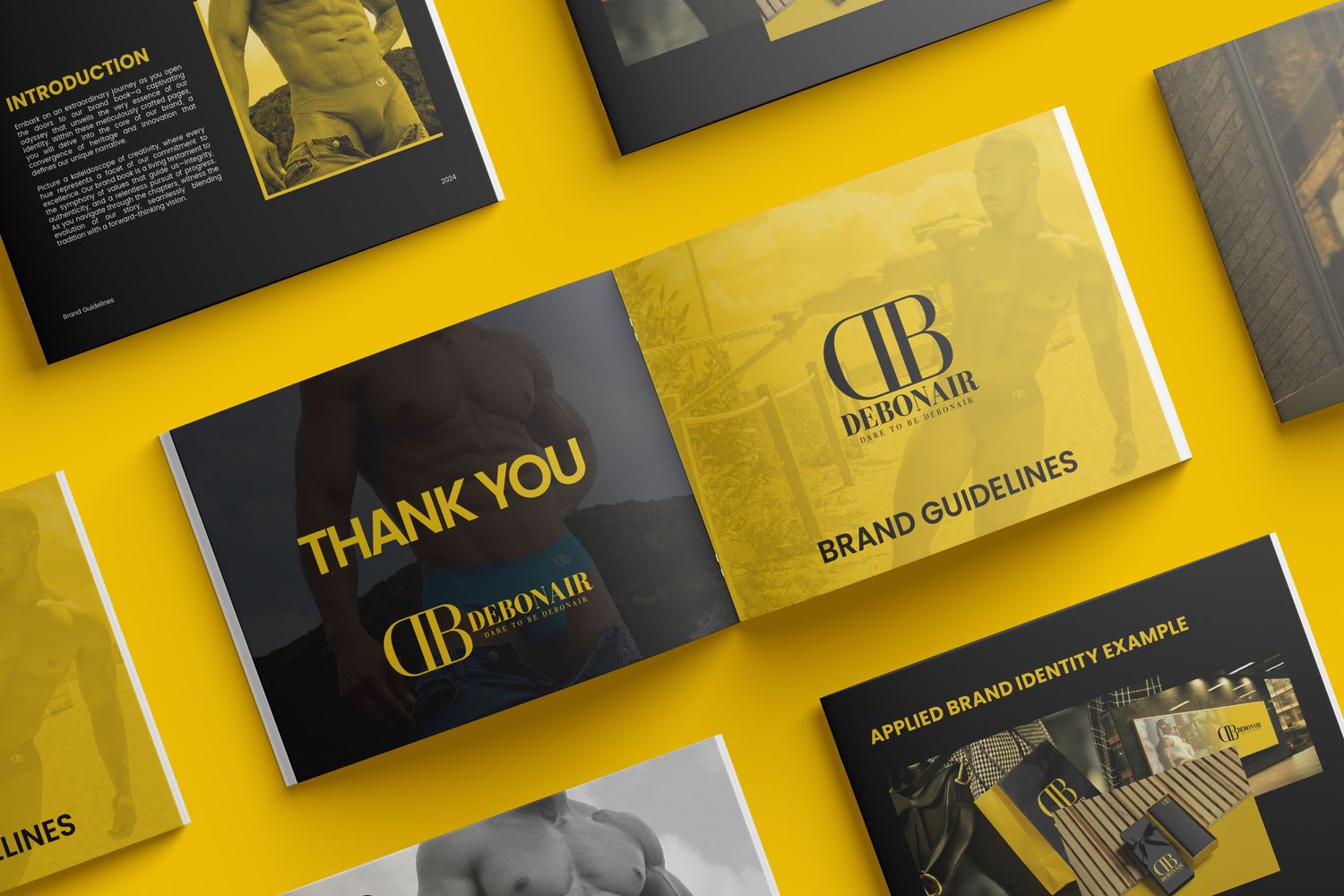 Luxury business cards with gold and black design elements arranged on yellow background showing brand guidelines.