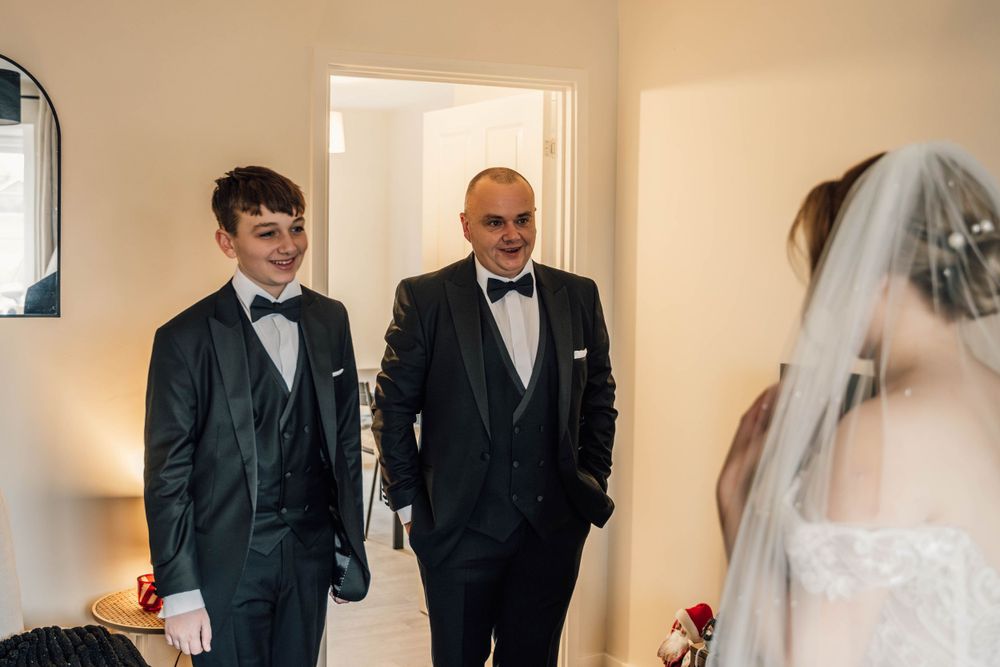 Wedding party members sharing joyful moments before the ceremony.