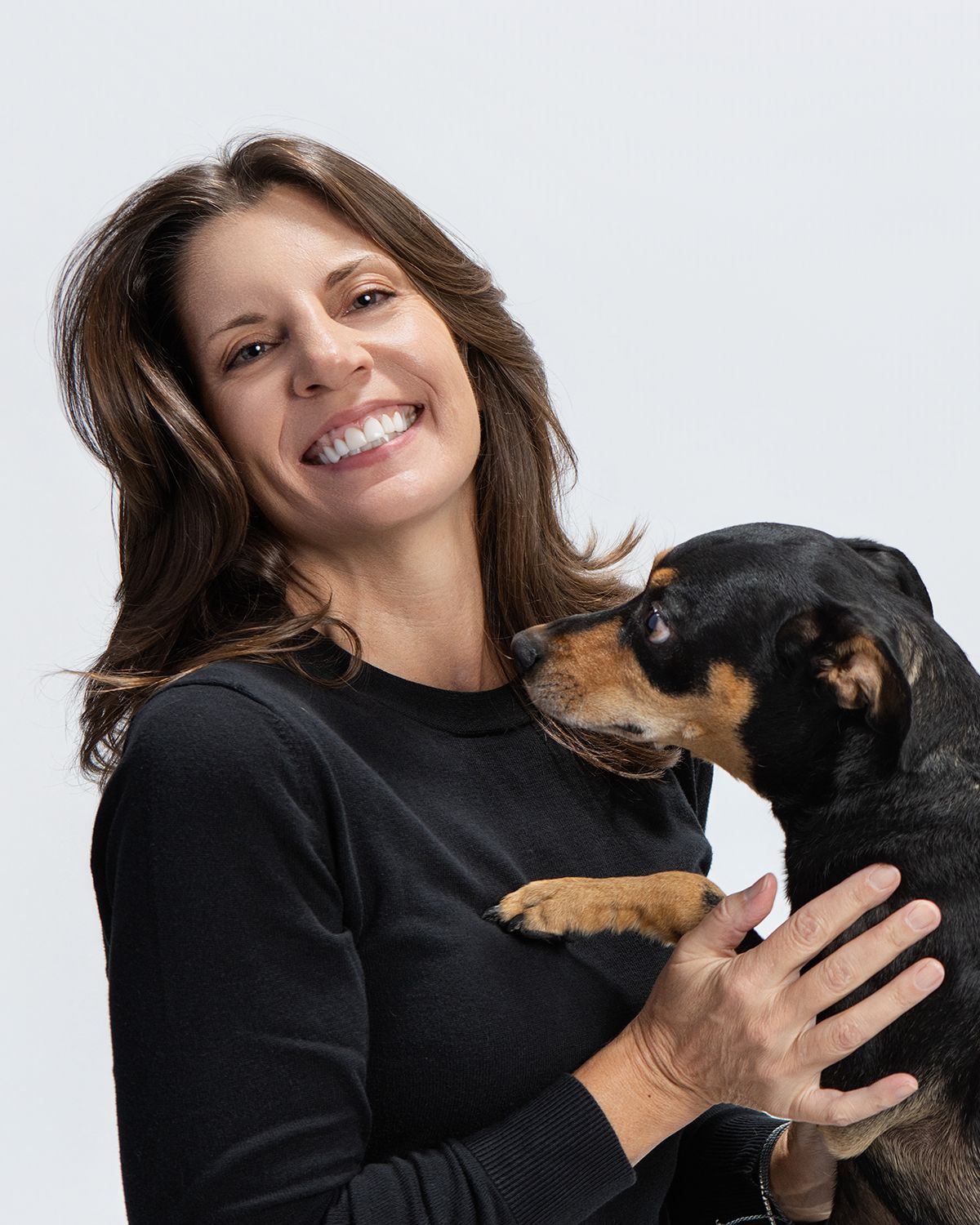 Portrait of Jane Fidanza, the pet photographer in Austin, TX, posing with her dog Giovanni.