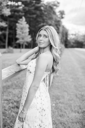 High school senior during her Spring 2026 Cincinnati senior portraits in a field. Authentic senior photography by Faith’s Flicks.