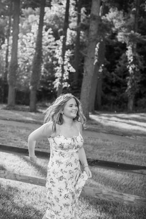 High school senior during her Spring 2026 Cincinnati senior portraits in a field. Authentic senior photography by Faith’s Flicks.