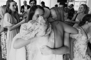 Sunshine Coast wedding photographer capturing joyful bride and guest in Noosa