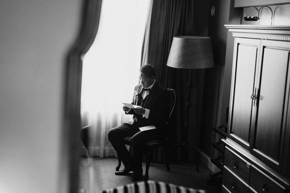 Groom’s emotional reading a letter by Brisbane wedding photographer"