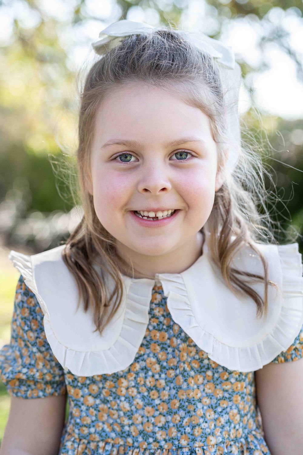 Artistic timeless portrait of a child in beautiful soft flattering light at an outdoor popup in Perth
