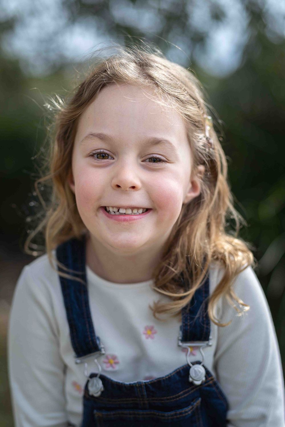 Artistic timeless portrait of a child in beautiful soft flattering light at an outdoor popup in Perth