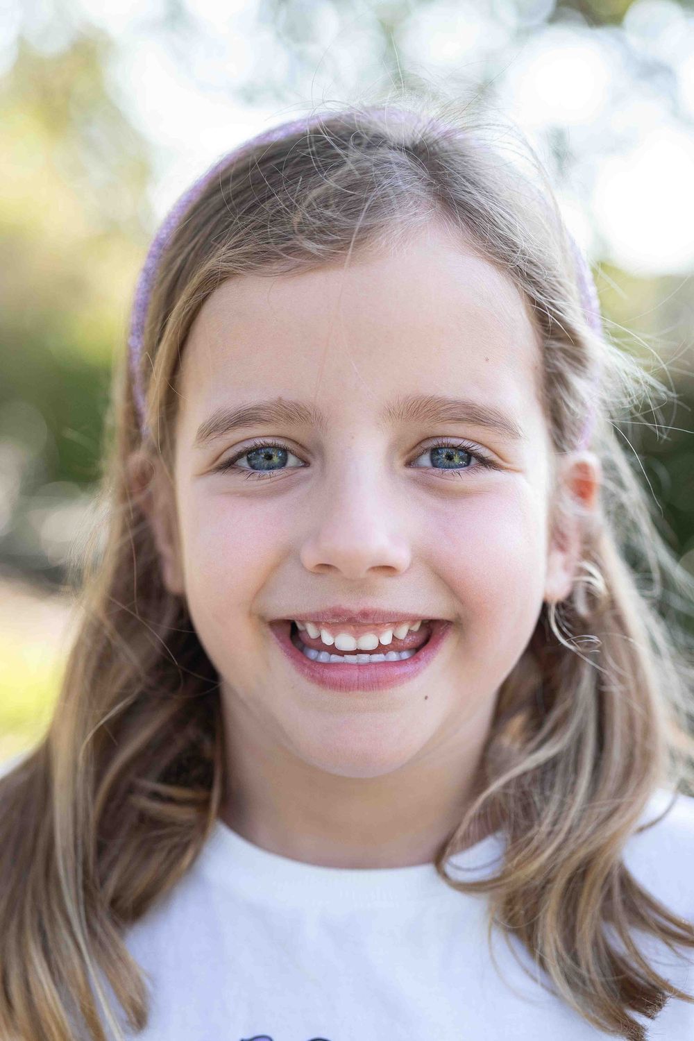 Artistic portrait of a child in beautiful soft flattering light at an outdoor popup in Perth