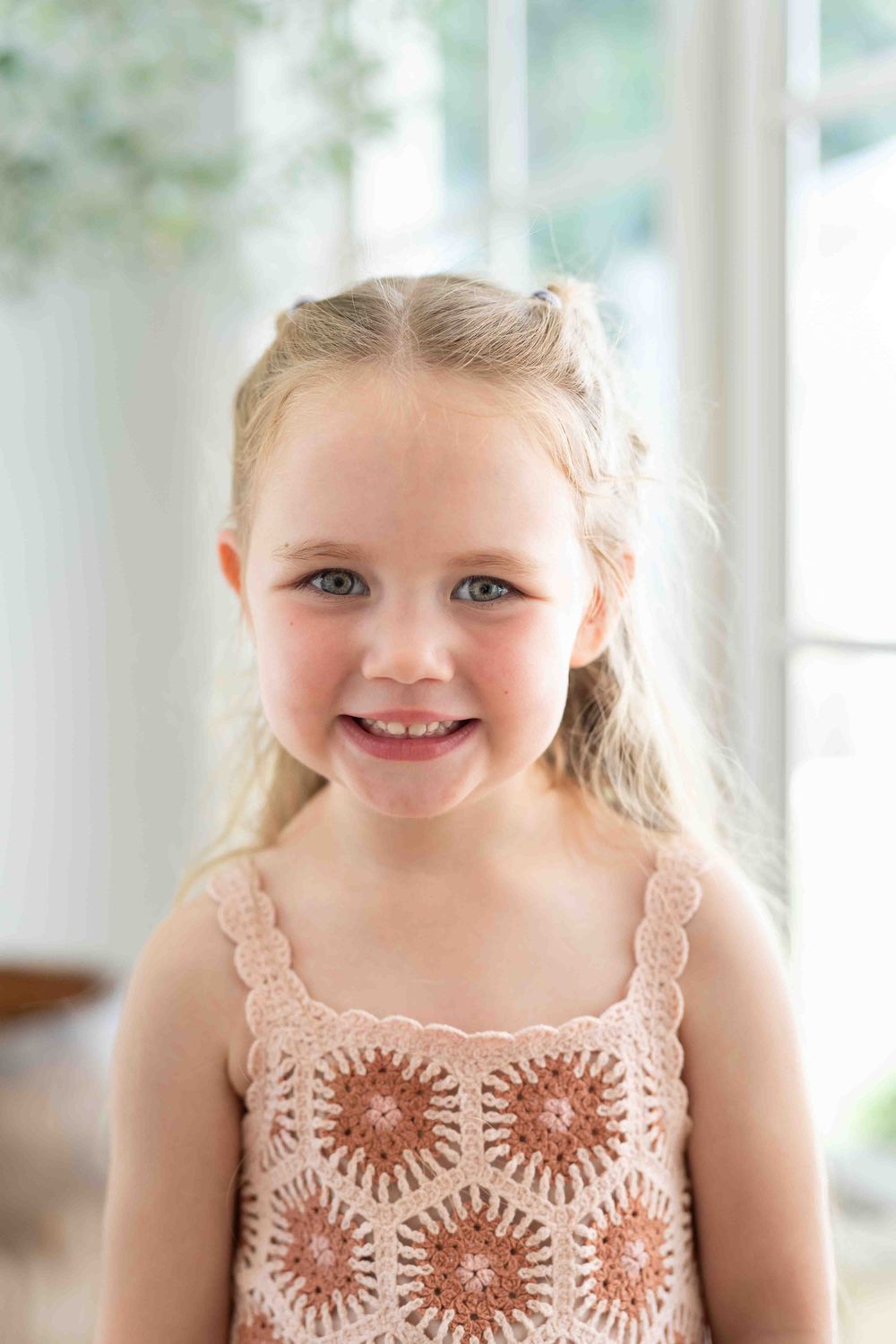 Portrait of a young girl in mid-morning light at an indoor family photography session in Perth