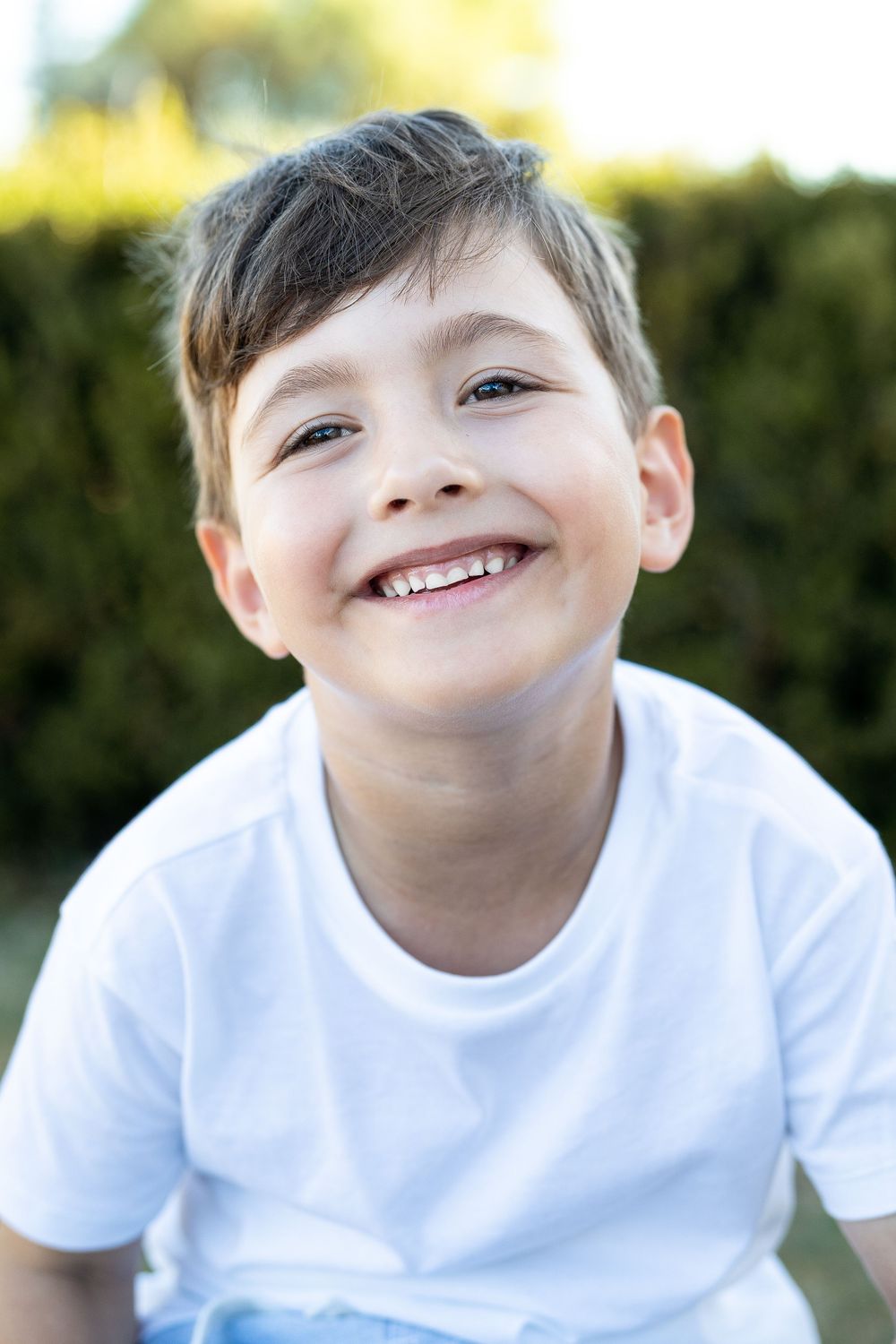 Portrait of a young boy in golden light at an outdoor sunset family photography session in Perth