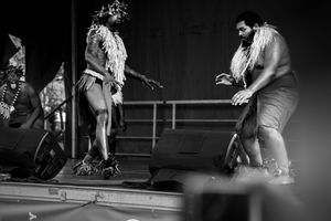 Dynamic black and white performance shots on stage.