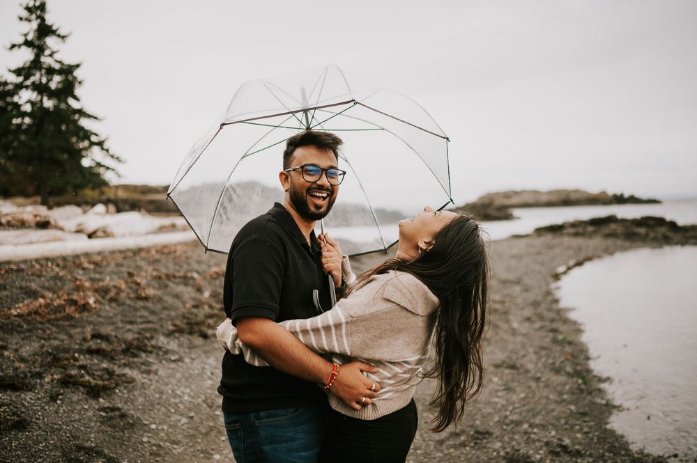 Professional Photographer Engagement Photoshoot at Neck Point Park, Nanaimo, Vancouver Island of couple laughing and hugging