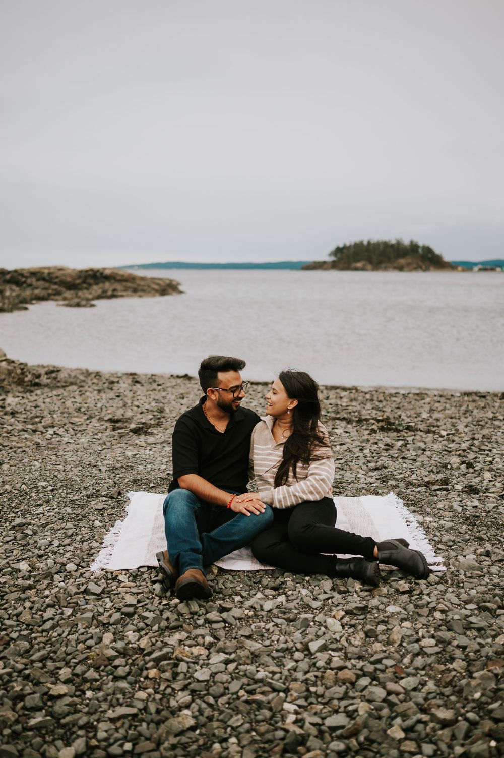 Neck Point Park, Nanaimo, Vancouver Island Engagement Photographer Photoshoot of couple sitting on picnic blanket looking at each other