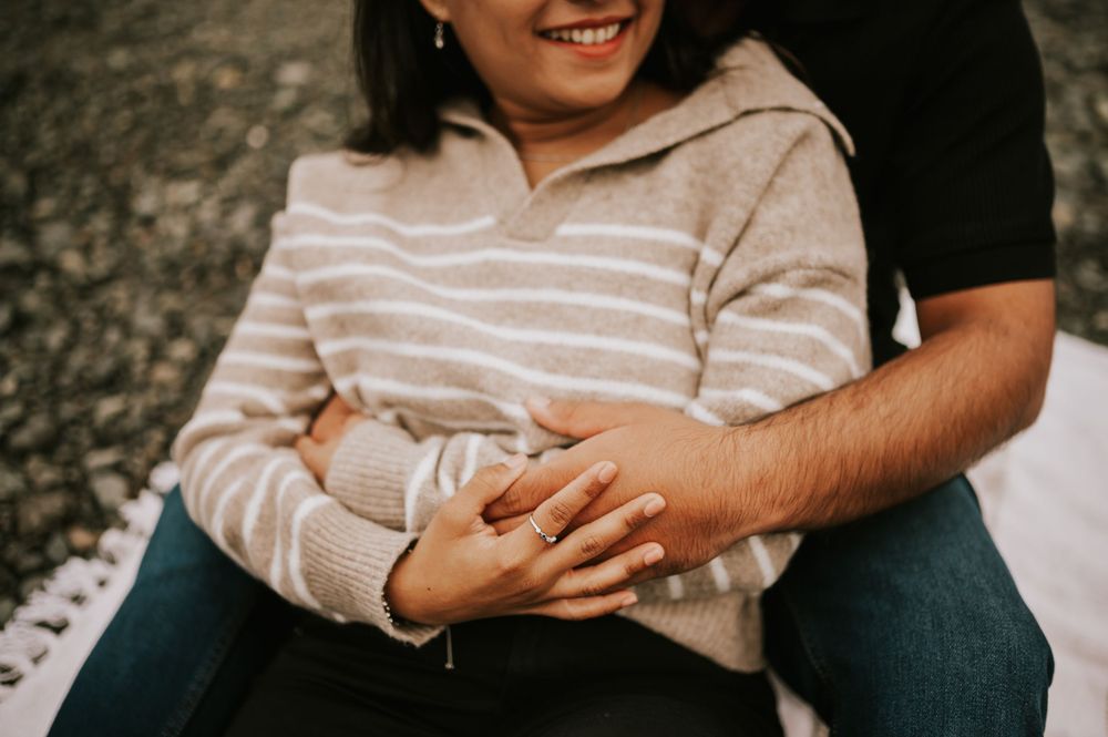Professional Photographer Engagement Photoshoot at Neck Point Park, Nanaimo, Vancouver Island of couple hands hugging