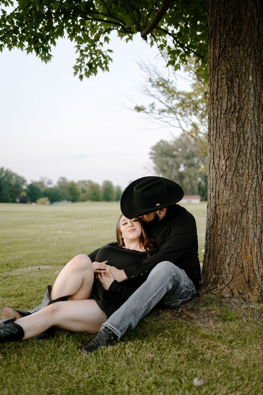 Three artistic photos show someone resting peacefully under a tree on a grassy lawn in warm sunlight.