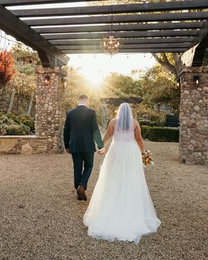 A sequence of wedding photos showing a couple walking along a stone path under a pergola during golden hour.