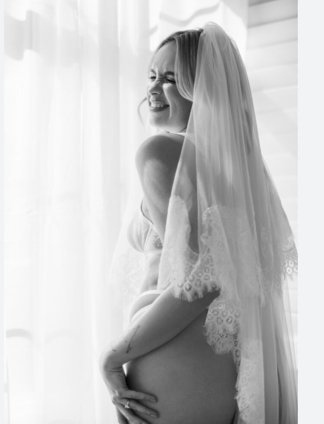 A bride in a white wedding dress and veil poses by a window in a series of elegant silhouette portraits.