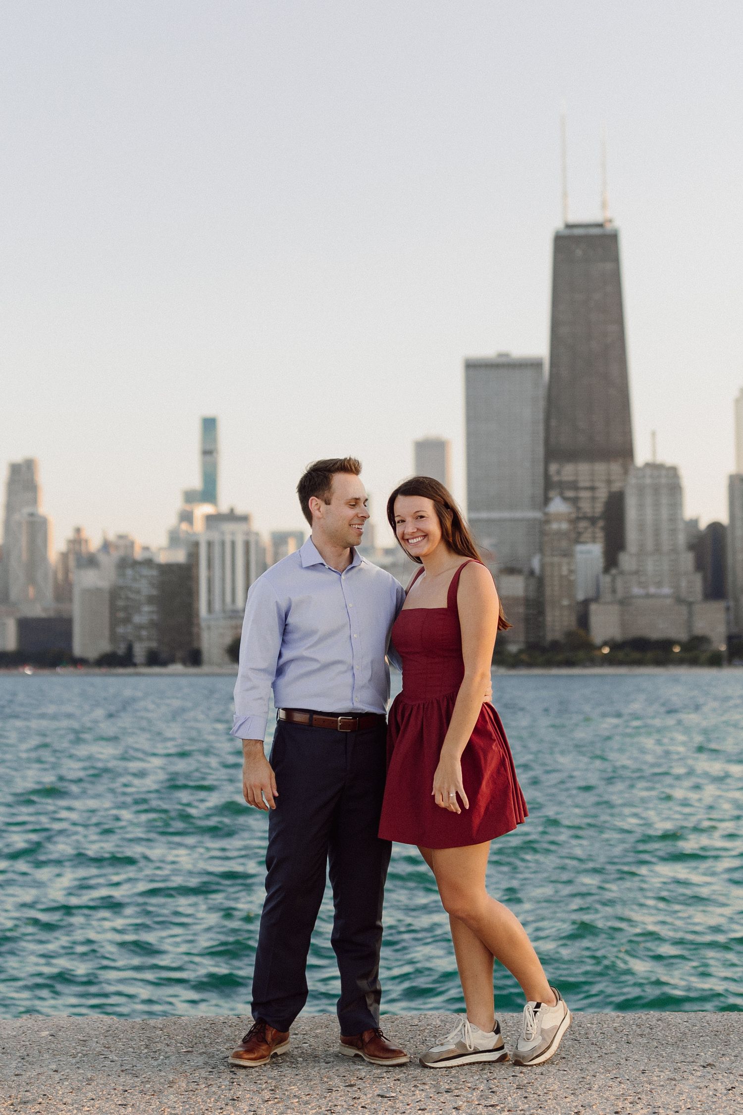 Romantic couple enjoying views of Chicago skyline from North Avenue Beach.