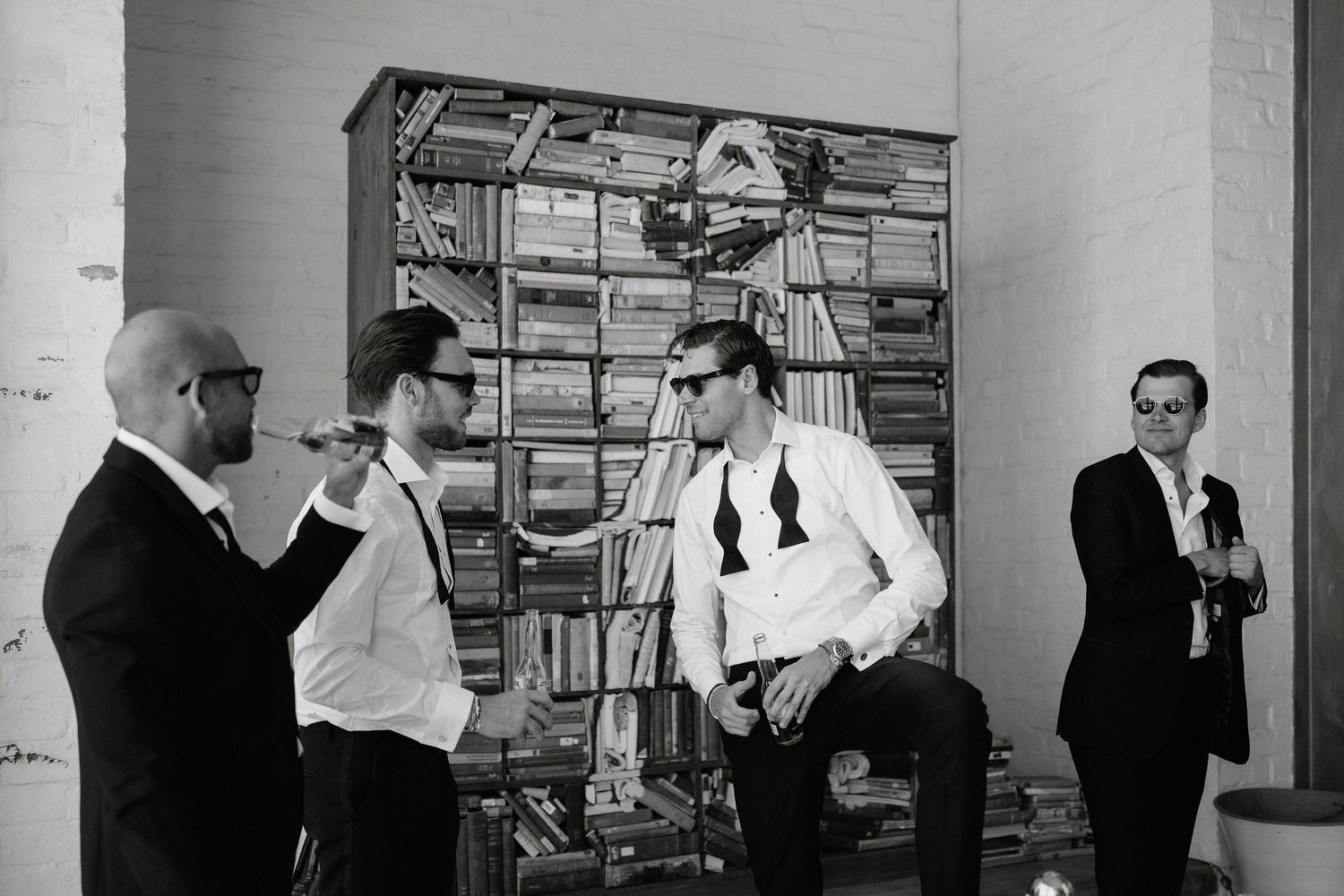 Black and white photo series showing office workers organizing mail and documents in a vintage postal sorting room.