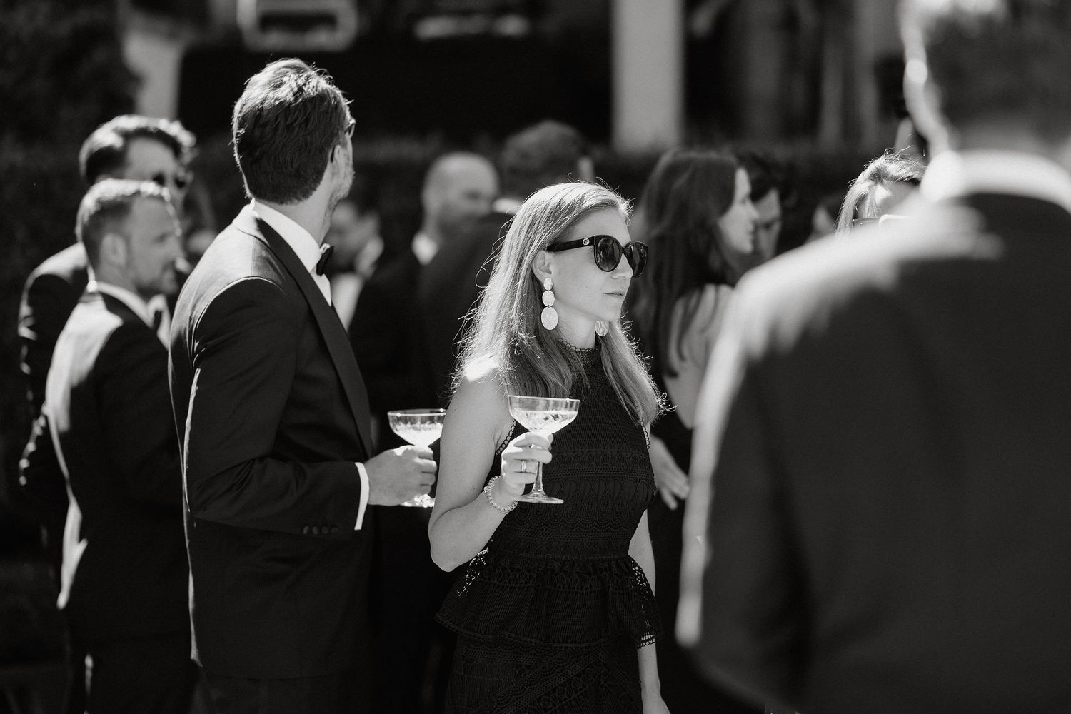 A black and white photo shows a couple dancing closely together at what appears to be a formal event or wedding.