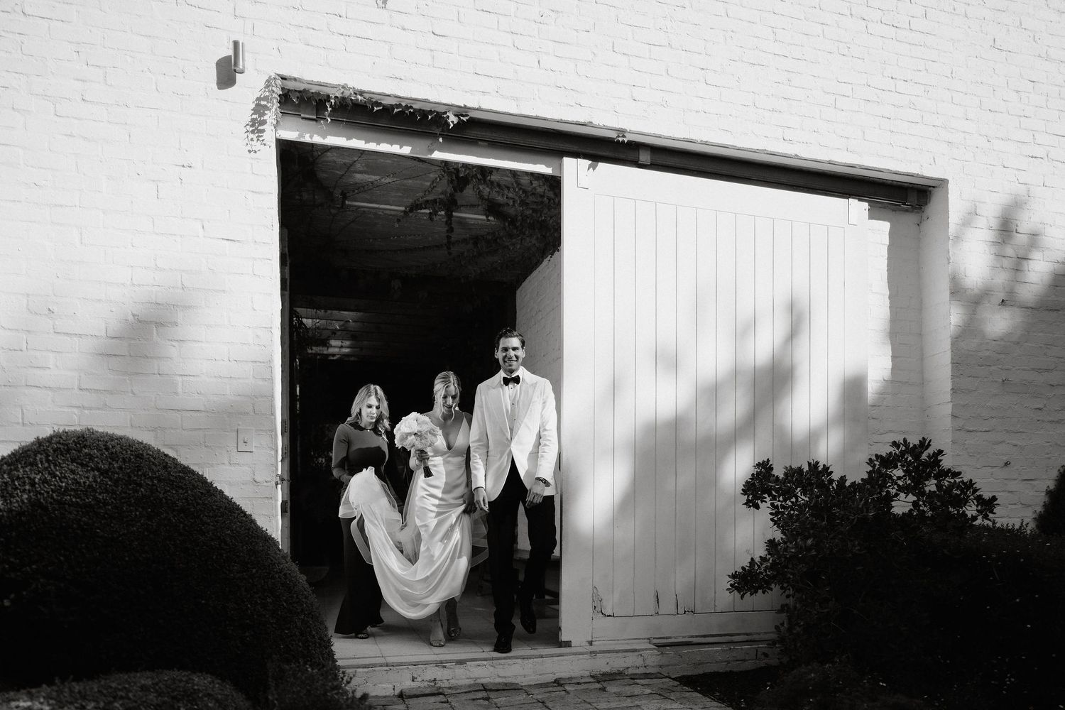 A series of black and white photographs arranged horizontally showing architectural details and doorways.