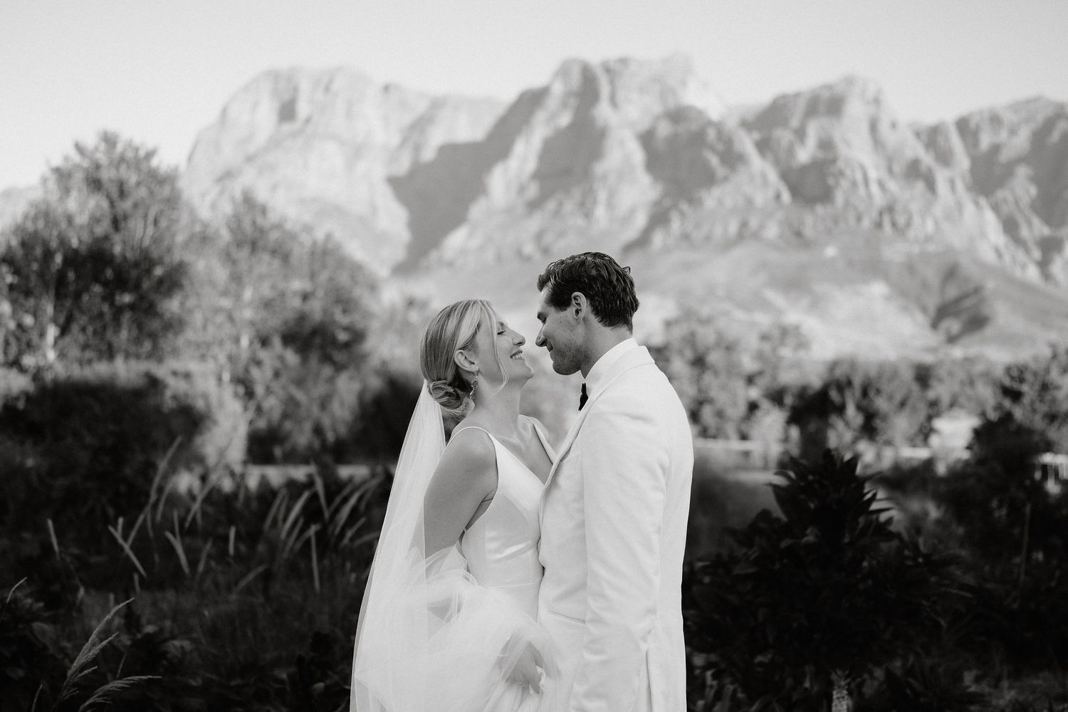 Black and white wedding photography with majestic mountain scenery.
