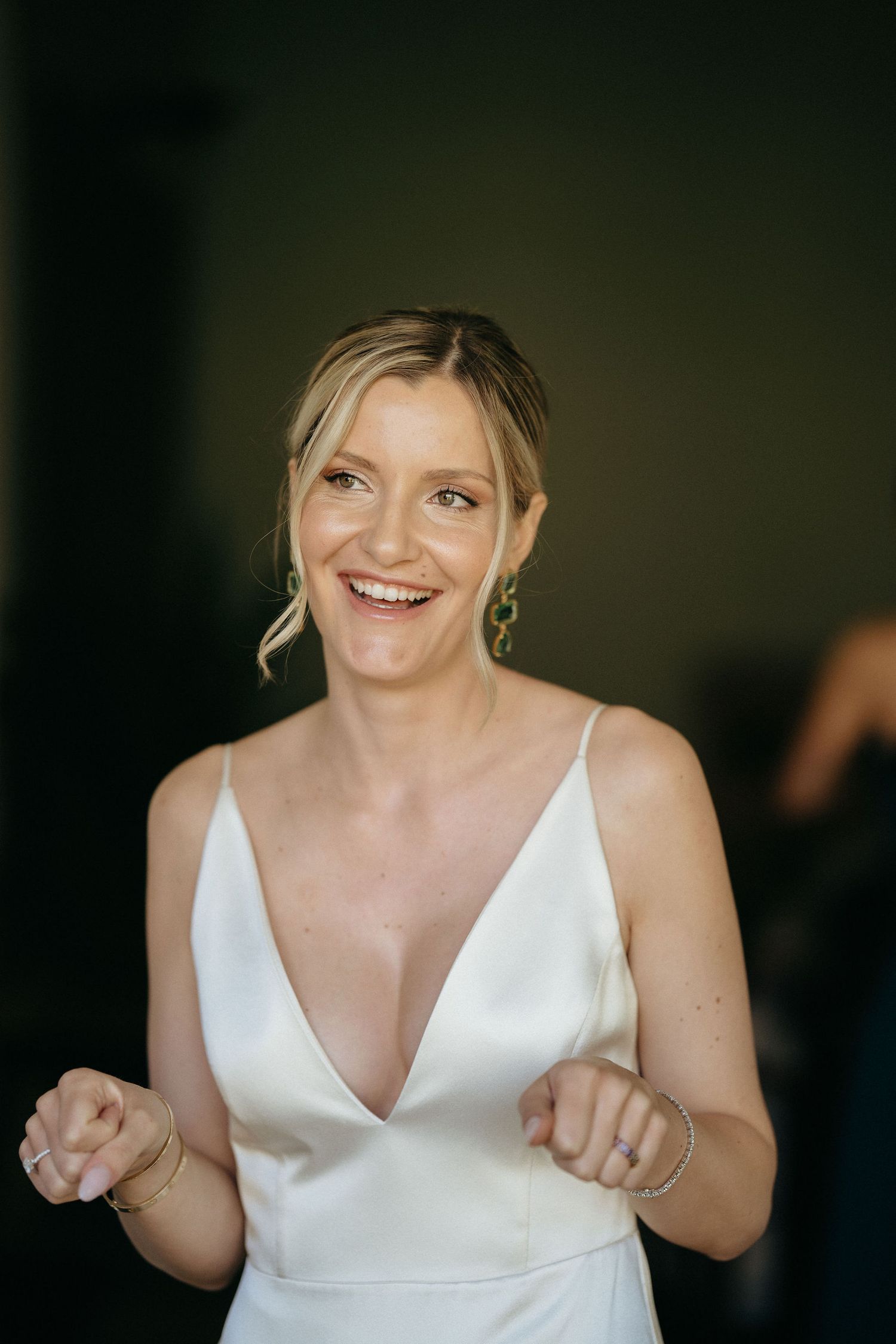A person wearing a white sleeveless dress shows joyful expressions in a series of candid portrait shots.