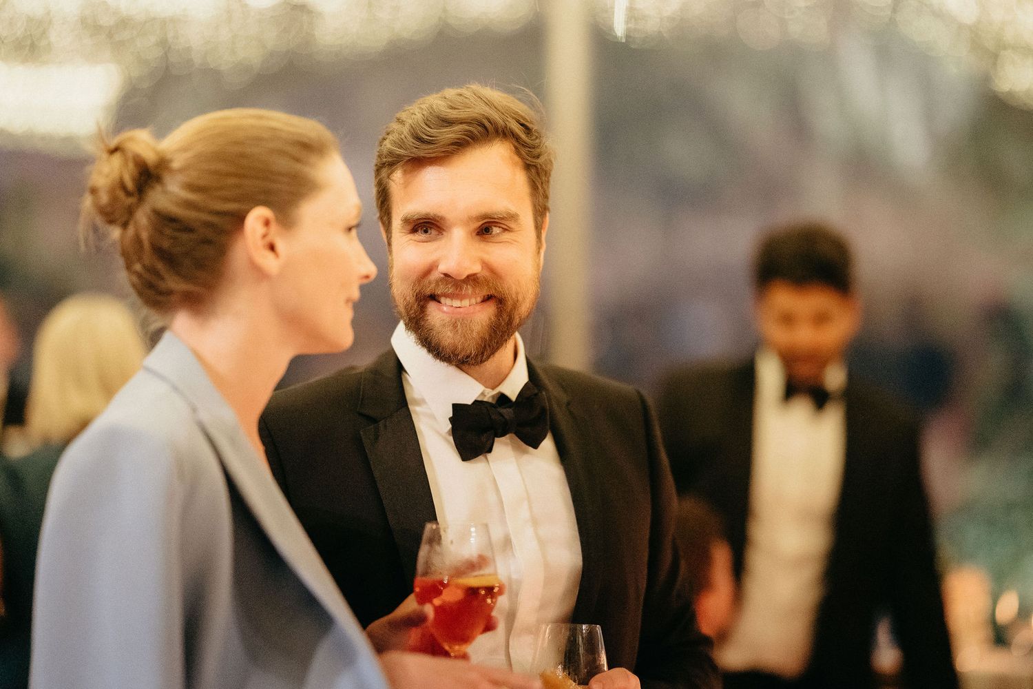 A wedding couple shares an intimate moment together during their reception celebration.
