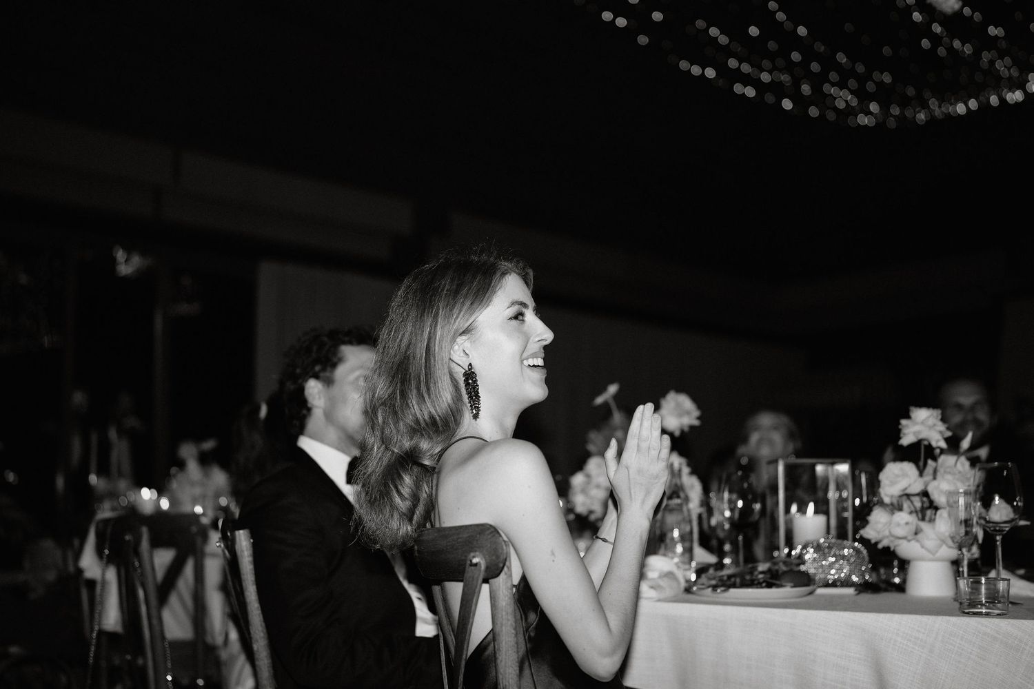 Black and white wedding reception photos show guests celebrating and dancing at an elegant evening event.