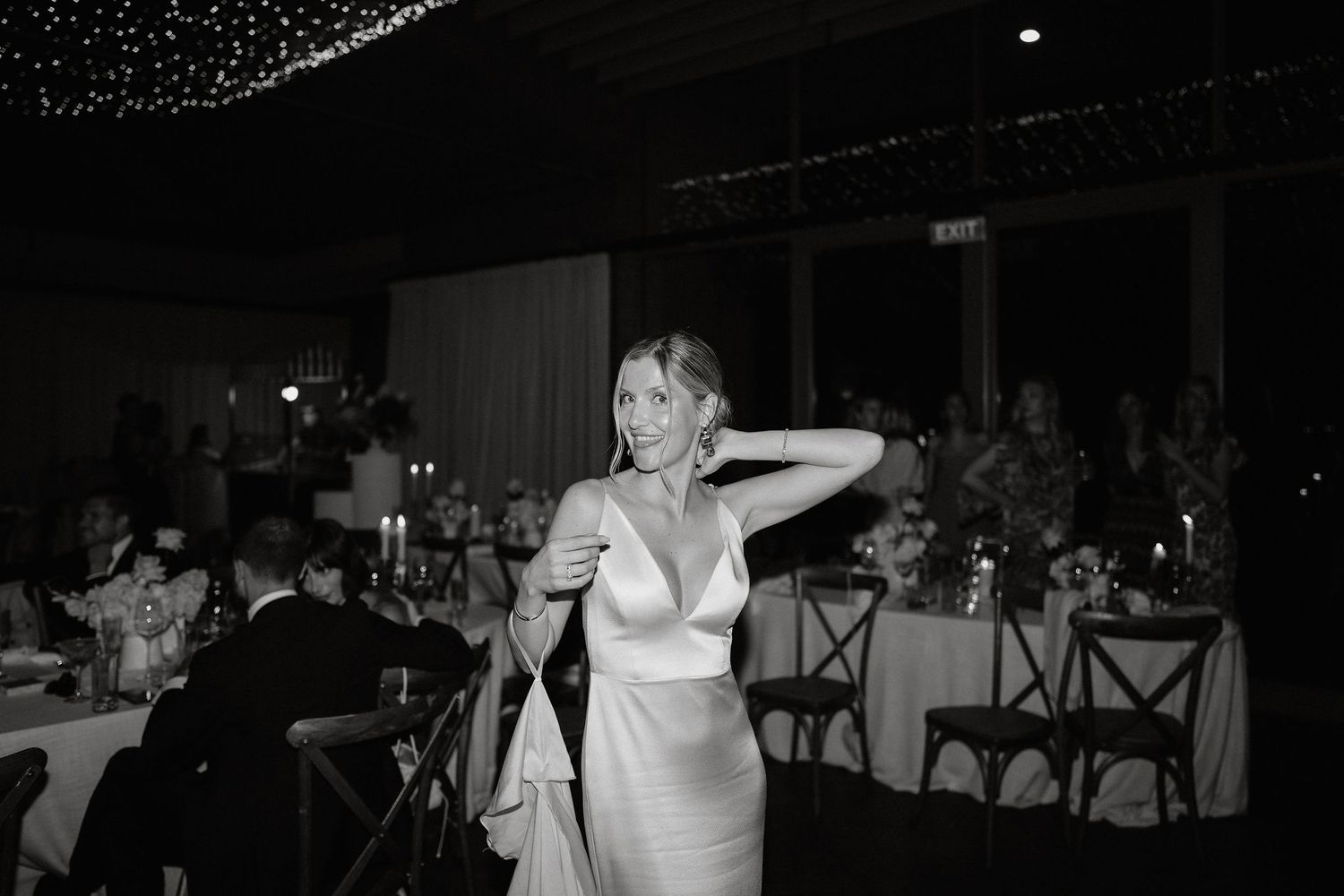 A series of black and white wedding reception photos showing dancing and celebration at an evening event.