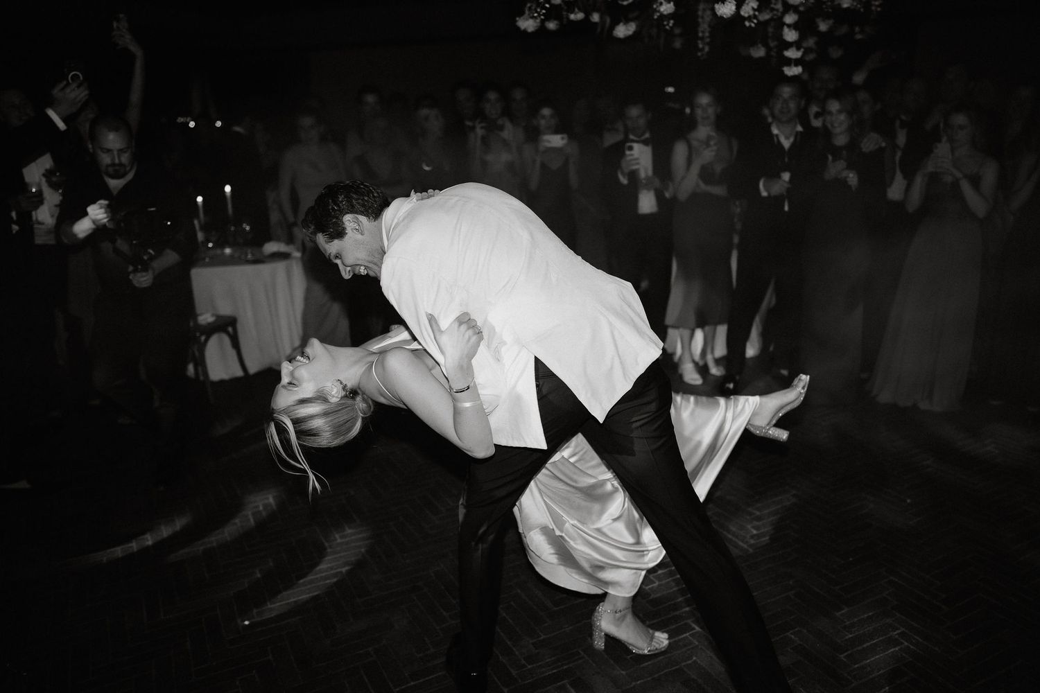 A breakdancer performs an athletic move on the ground during a street dance performance.