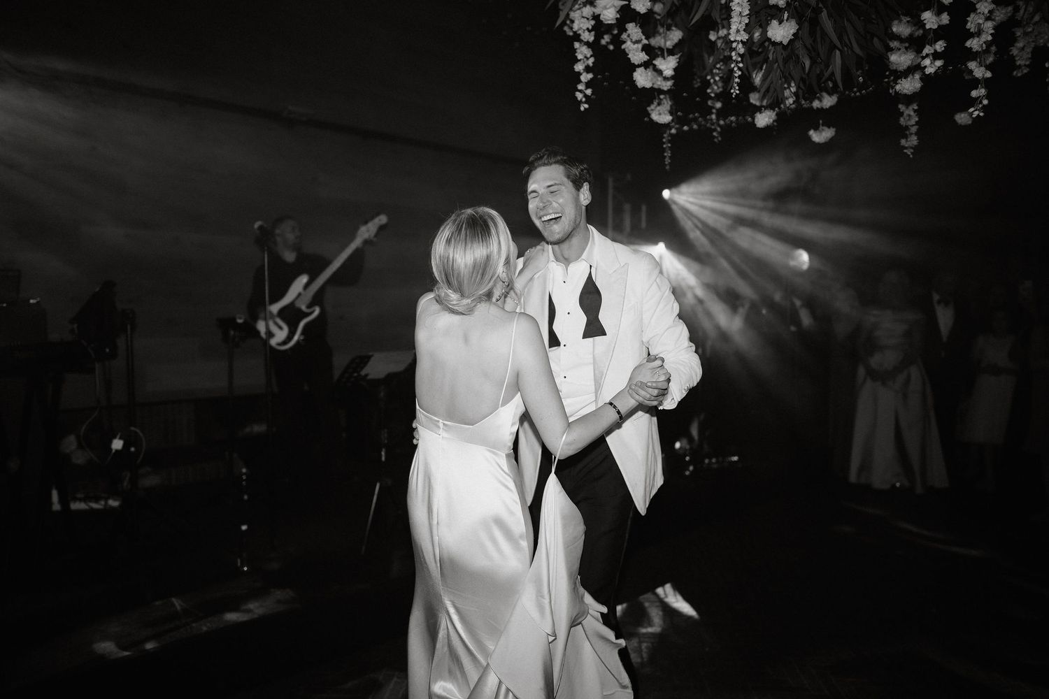 A collection of black and white wedding dance photos showing couples sharing intimate moments on the dance floor.