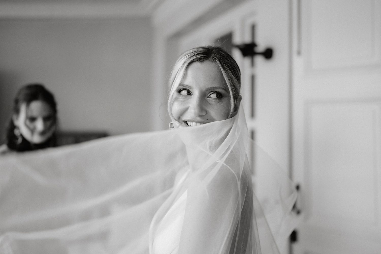 A series of black and white photos showing a bride getting ready for her wedding ceremony.