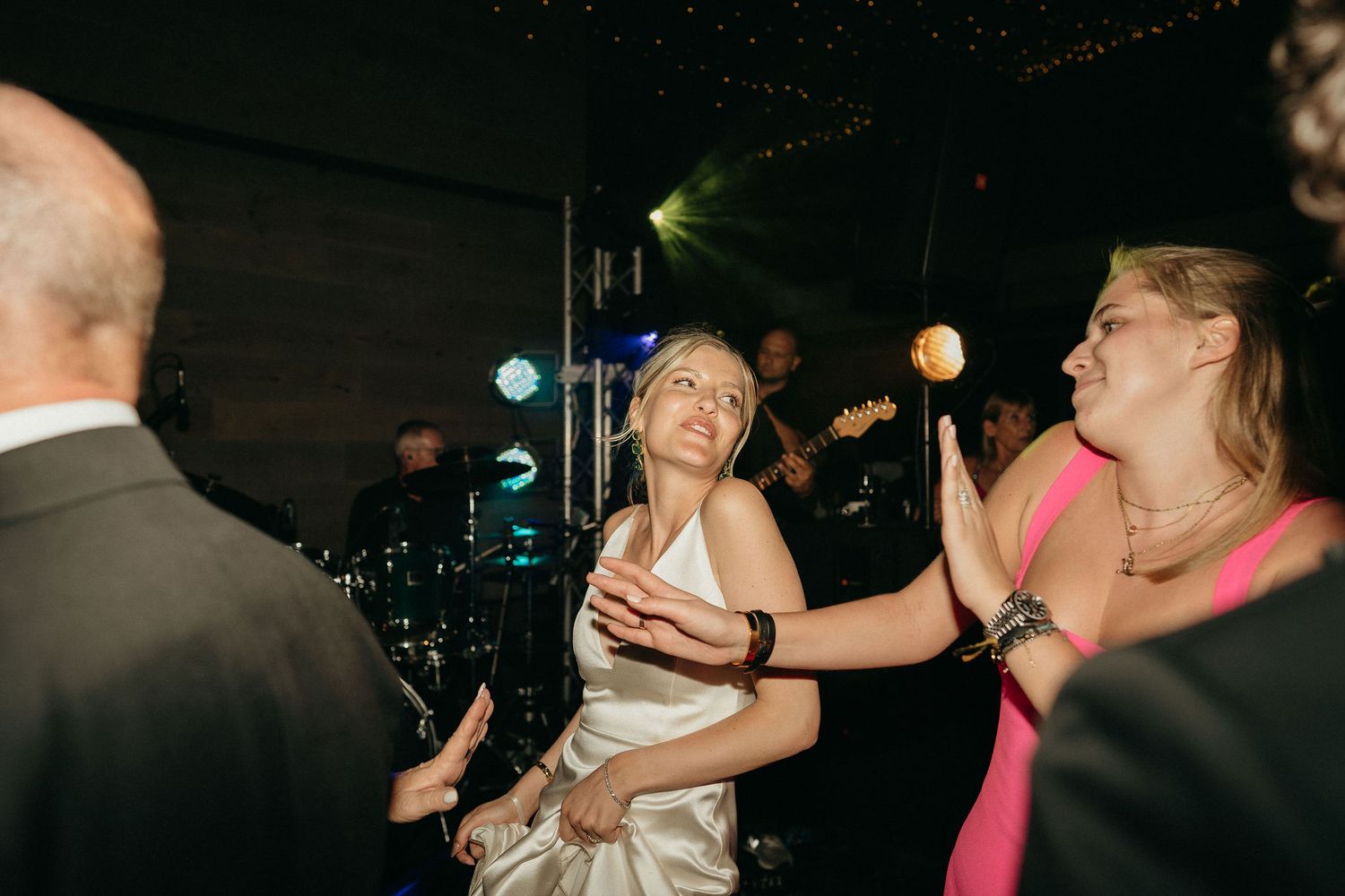 People dancing and having fun at a nighttime party or celebration event.