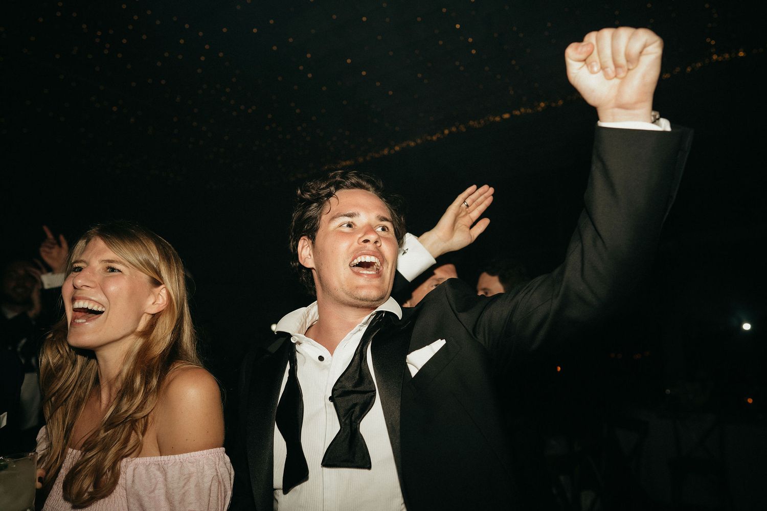 A series of candid black and white party photos showing people dancing and celebrating in a dark venue.