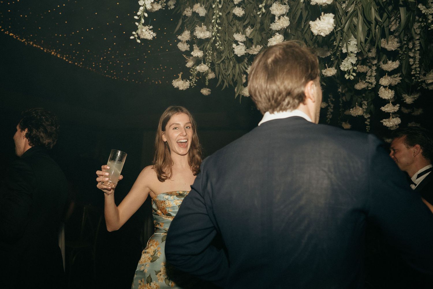 A sequence of dark party photos showing couples dancing and celebrating at a festive evening event.