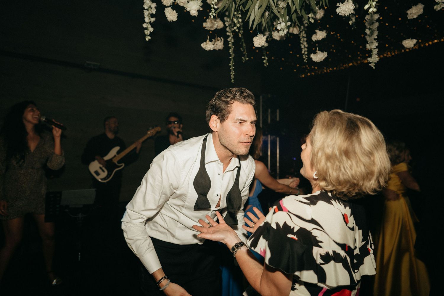 A group of people dancing together at what appears to be a lively party or celebration.