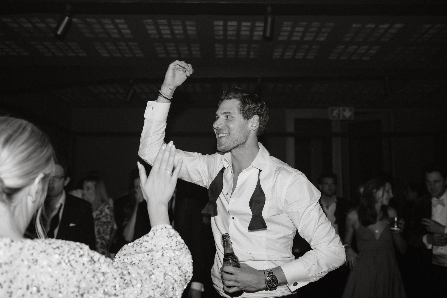 Black and white photographs showing couples dancing together at what appears to be a formal event or celebration.