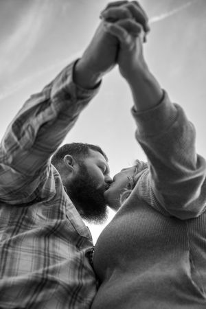 A sequence of black and white profile shots showing a person in plaid shirt leaning back in motion.