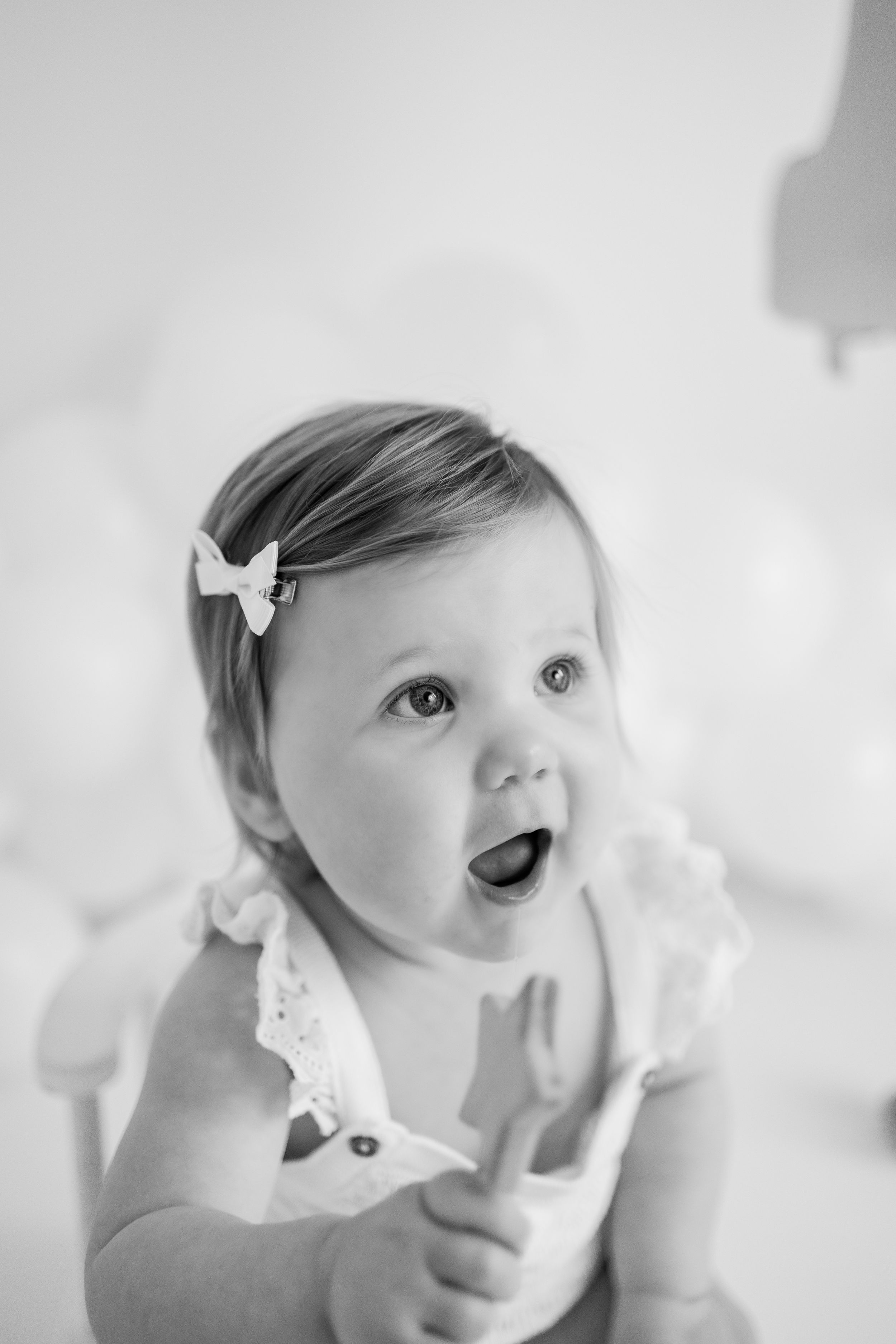 Black and white artistic portrait series showing close-up details and expressions in dreamy ethereal lighting.