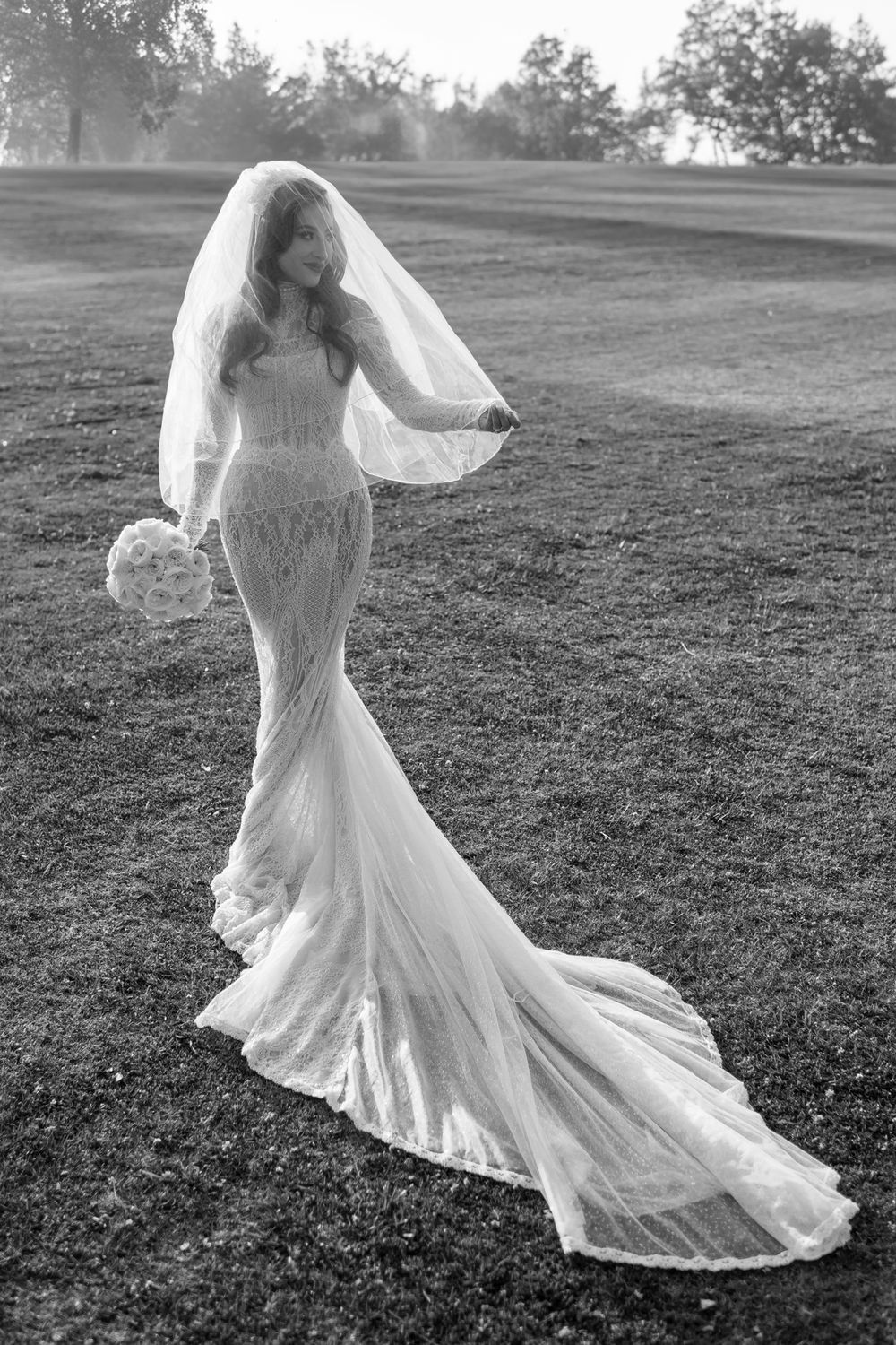 Black and white series of a flowing wedding dress twirling in an outdoor setting.